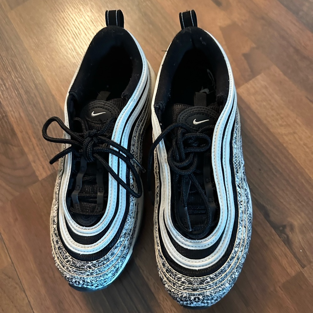 - Women’s Nike Air Max 97 Black/White snake sneakers